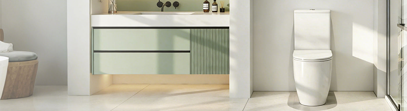 Bathroom with a toilet and shower area featuring leaf-patterned tiles.