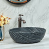 Oval Stone Basin Above Counter Marble Surface