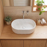 Infinity Oval Fluted Ceramic Above Counter Basin 555x355x150mm - Variant Colour