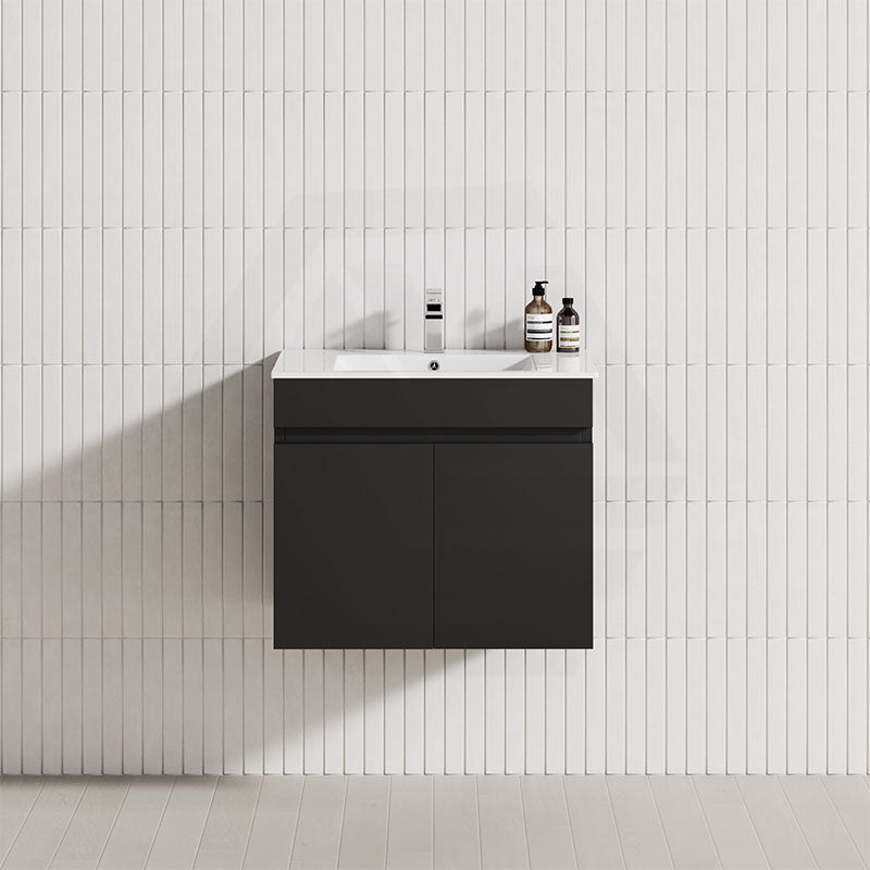 A matt black floating vanity with a single bowl sink above it