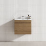 A modern bathroom featuring a Tasmanian oak wall-hung vanity cabinet with a single bowl sink