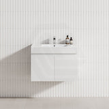 A wall-hung matt white bathroom vanity with a single bowl sink, showcasing a modern floating design