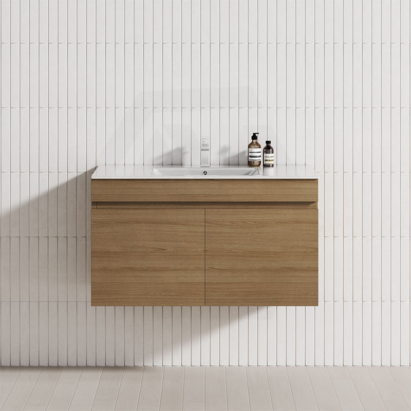 Wall-hung bathroom vanity in Tasmanian Oak, featuring a single bowl and two cabinet doors