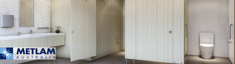 Commercial bathroom equipped with Metlam hand dryers and grab rails.
