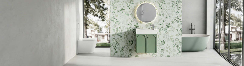 Modern bathroom with green tiles, white sink, and bathtub.