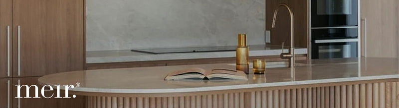 Designer kitchen with Meir matte black tapware and round island bench