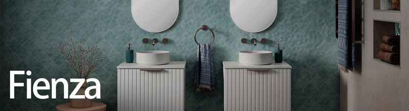 Twin vanity setup with Fienza basins, mirrors, and lighting in a designer bathroom