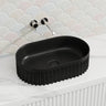 555x355x150mm Infinity Oval Fluted Ceramic Above Counter Basin Matt Black