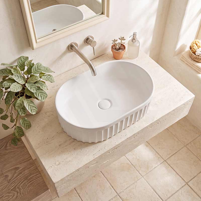Infinity Oval Fluted Ceramic Above Counter Basin 555x355x150mm - Variant Colour