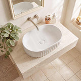 Infinity Oval Fluted Ceramic Above Counter Basin 555x355x150mm - Variant Colour
