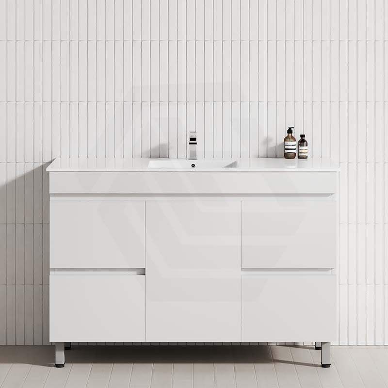 Stylish bathroom vanity against a white tiled wall, showcasing a 4-drawer, 1-door design in matt white