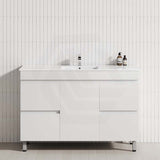 Stylish bathroom vanity against a white tiled wall, showcasing a 4-drawer, 1-door design in matt white