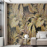 Living room with a decorative wall featuring gold and black leaf pattern